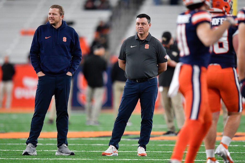 (Adrian Kraus | AP) Former Syracuse offensive coordinator Jason Beck, left, watches warmups before a game against Wake Forest in Syracuse, N.Y., Saturday, Nov. 25, 2023. Beck is expected to be the University of Utah's next offensive coordinator.