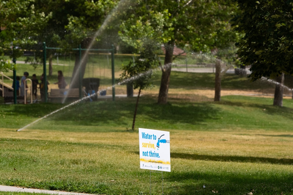 (Francisco Kjolseth | The Salt Lake Tribune) Sprinklers run at Reservoir Park in the middle of the afternoon heat during peak evaporations times on Monday afternoon, July 19, 2021, near the University of Utah campus.
