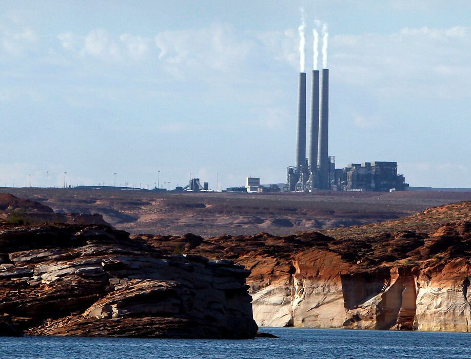 (Ross D. Franklin | The Associated Press) This Sept. 4, 2011 file photo shows the main plant facility at the Navajo Generating Station northeast of Grand Canyon National Park as seen from Lake Powell in Page, Ariz. A new study concludes visitors may be steering clear of some U.S. national parks or cutting their visits short because of pollution.