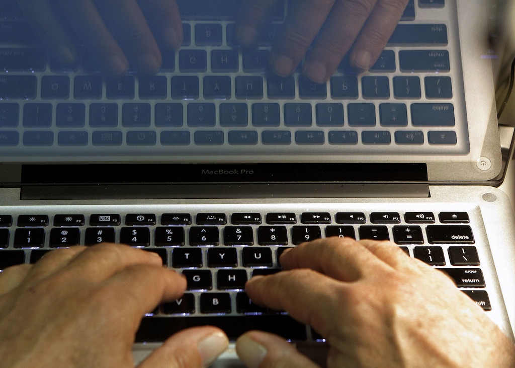 (Damian Dovarganes | AP file photo) In this Feb. 27, 2013, file photo, hands type on a computer keyboard in Los Angeles. A new pilot program sponsored by Salt Lake City, Salt Lake County and The Church of Jesus Christ of Latter-day Saints is offering limited hours of free Wi-Fi and computer access to Rose Park residents who don't have it at home.