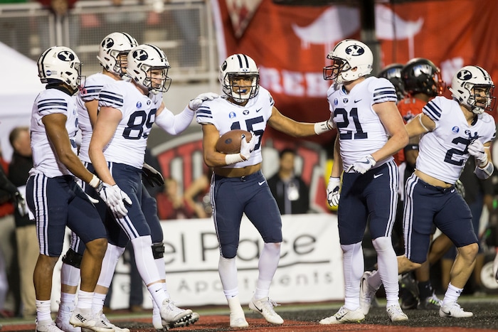 Brigham Young Cougars wide receiver Aleva Hifo (15) celebrates his touchdown against the UNLV Rebels during an NCAA college football game Friday, Nov. 10, 2017, in Las Vegas. (Erik Verduzco/Las Vegas Review-Journal via AP)