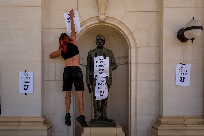 (Trent Nelson | The Salt Lake Tribune) Protesters put up posters at the University of Utah in Salt Lake City on Thursday, Sept. 3, 2020. The protest called for President Ruth Watkins to resign and for the campus police department to be dissolved..