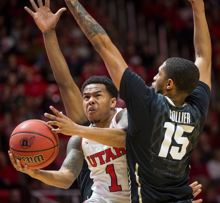 (Rick Egan  |  The Salt Lake Tribune)  Utah Utes guard Justin Bibbins (1) takes the ball to the hoop, as Colorado Buffaloes guard Dominique Collier (15) defends, in PAC-12 basketball action between Utah Utes and Colorado Buffaloes, at the Jon M. Huntsman Center, Saturday, March 3, 2018.
