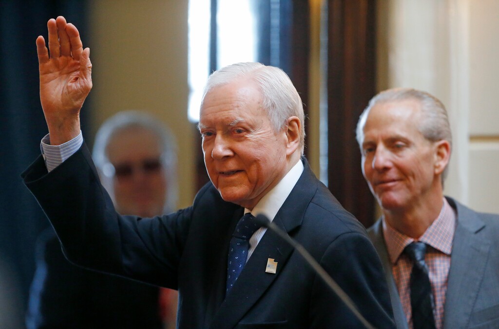 Sen. Orrin Hatch, R-Utah, waves after addressing the Utah Senate while Senate President Wayne Niederhauser, R-Sandy, looks on, Wednesday, Feb. 21, 2018, at the Utah Capitol in Salt Lake City. Utah's Legislature unanimously passed a resolution Wednesday honoring the retiring Hatch. The resolution declared the day Orrin G. Hatch Day in honor of Hatch and his 40-plus years in the U.S. Senate. (AP Photo/Rick Bowmer)