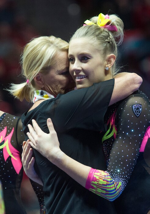 (Rick Egan  |  The Salt Lake Tribune)   coach Megan Marsden hugs MaKenna Merrell-Giles after her performance on the beam for Utah, in Gymnastics action Utah vs. Oregon State at the Jon M. Huntsman Center, Friday, January 19, 2018.
