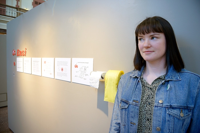 (Chris Samuels | The Salt Lake Tribune) Hannah Lutz poses for a photo with her exhibit Ensi, a redesign of a menstrual hygiene product dispenser, at a showcase for Utah Design Arts at the Rio Grande Depot in Salt Lake City, Sept. 12, 2019.