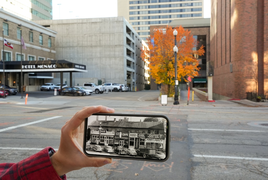 (Chris Samuels | The Salt Lake Tribune) Leo Mašić shows a picture of former buildings on 200 South, juxtaposed with the location's current identity as the entrance to the Hotel Monaco, in Salt Lake City, Friday, Nov. 17, 2023.