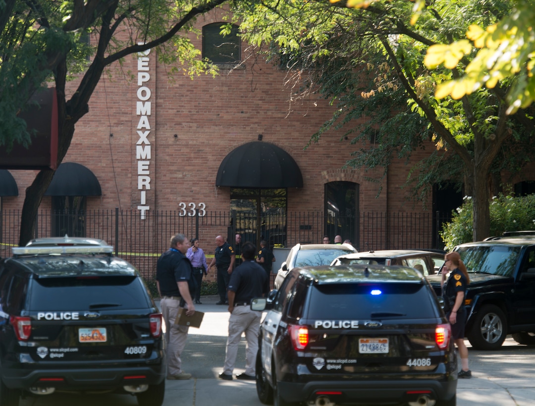 (Rick Egan  |  The Salt Lake Tribune)   Police stand by on 400 south across from Pioneer Park, after a suspect that fired shots at a police officer was found dead in a nearby building, of an apparent self-inflicted gunshot.  Wednesday, Sept. 5, 2018.