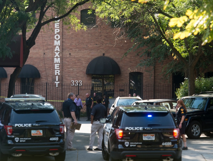 (Rick Egan  |  The Salt Lake Tribune)   Police stand by on 400 south across from Pioneer Park, after a suspect that fired shots at a police officer was found dead in a nearby building, of an apparent self-inflicted gunshot.  Wednesday, Sept. 5, 2018.


