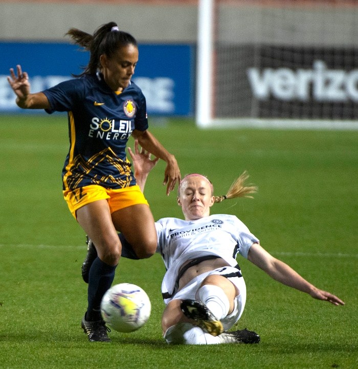 (Rick Egan | The Salt Lake Tribune) Utah Royals FC midfielder Taylor Lytle (12) goes for the ball along with Portland Thorns FC defender Becky Sauerbrunn (4), in soccer action between Utah Royals FC and Portland Thorns FC at Rio Tinto Stadium, on Saturday, Oct. 3, 2020.