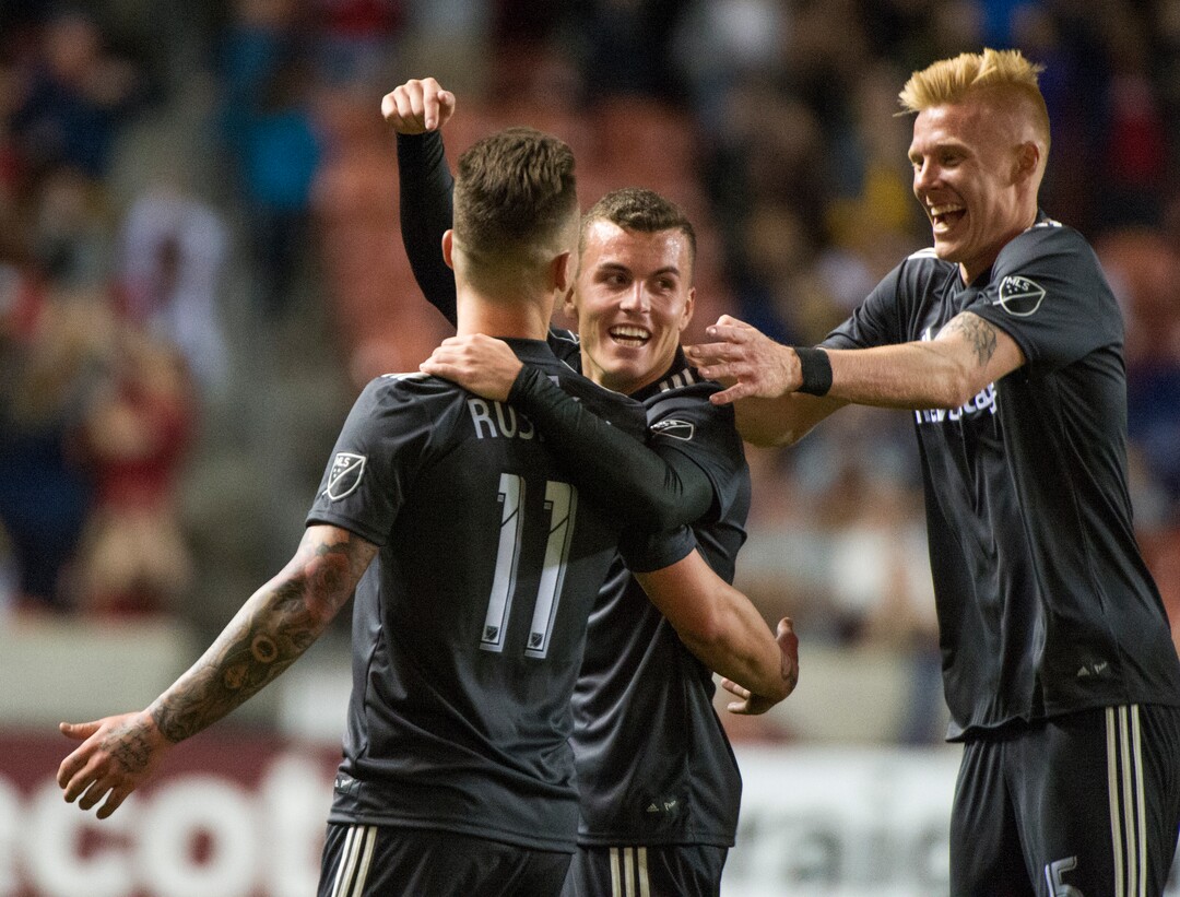 (Rick Egan  |  The Salt Lake Tribune)     Real Salt Lake forward Brooks Lennon (12) and Real Salt Lake defender Justen Glad (15) celebrate the goal by Real Salt Lake midfielder Albert Rusnak (11) late in the game, in MLS soccer action, between Real Salt Lake and Colorado Rapids,  at Rio Tinto Stadium, Saturday, April 21, 2018.
