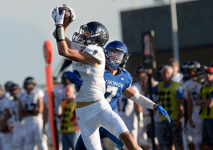 (Scott Sommerdorf | The Salt Lake Tribune) Corner Canyon WR Colton Lawson makes a catch against Pleasant Grove's Jayson McHugh during first half play. Corner Canyon drove for an early TD, and led Pleasant Grove 7-0, Friday, August 18, 2017.