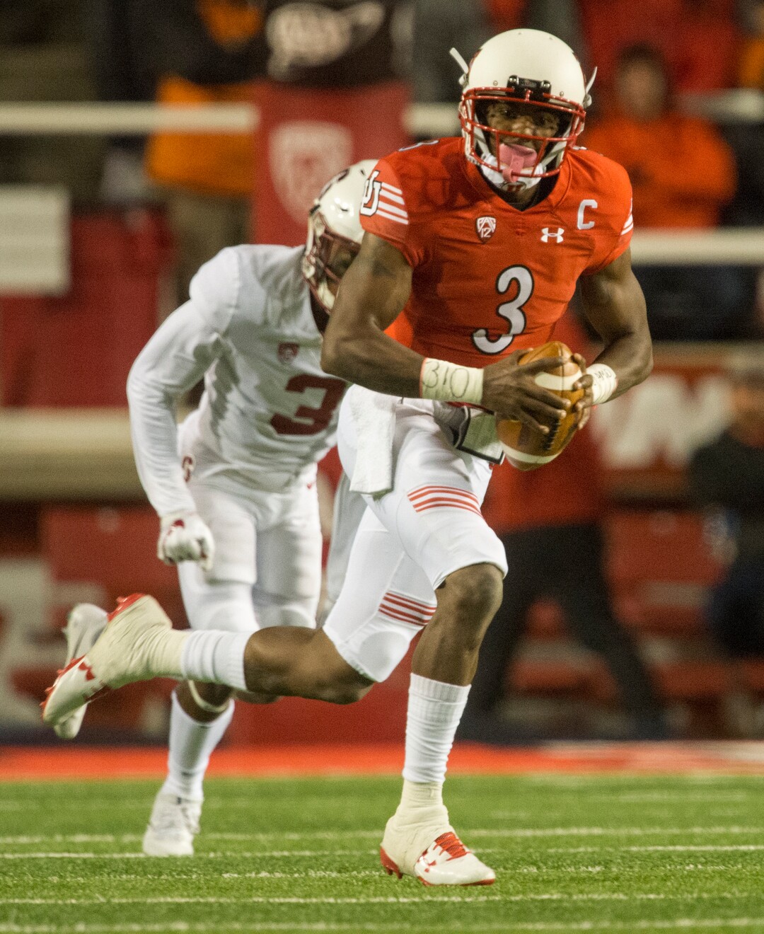 (Rick Egan  |  The Salt Lake Tribune)  Utah Utes quarterback Troy Williams (3) runs for a first down on a quarterback keeper, in PAC-12 football action, at Rice-Eccles Stadium, Saturday, October 7, 2017.