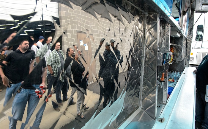 (Steve Griffin  |  The Salt Lake Tribune)  Access Development employees line up for a free food truck lunch on the company after attending an open enrollment benefits meeting at the South Salt Lake company on Nov. 16, 2017.