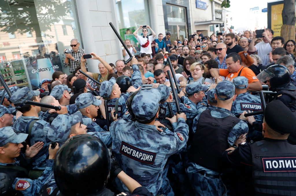 (Pavel Golovkin | AP Photo) Protesters clash with police during an unsanctioned rally in the center of Moscow, Russia, Saturday, July 27, 2019. Russian police are wrestling with demonstrators and have arrested hundreds in central Moscow during a protest demanding that opposition candidates be allowed to run for the Moscow city council.