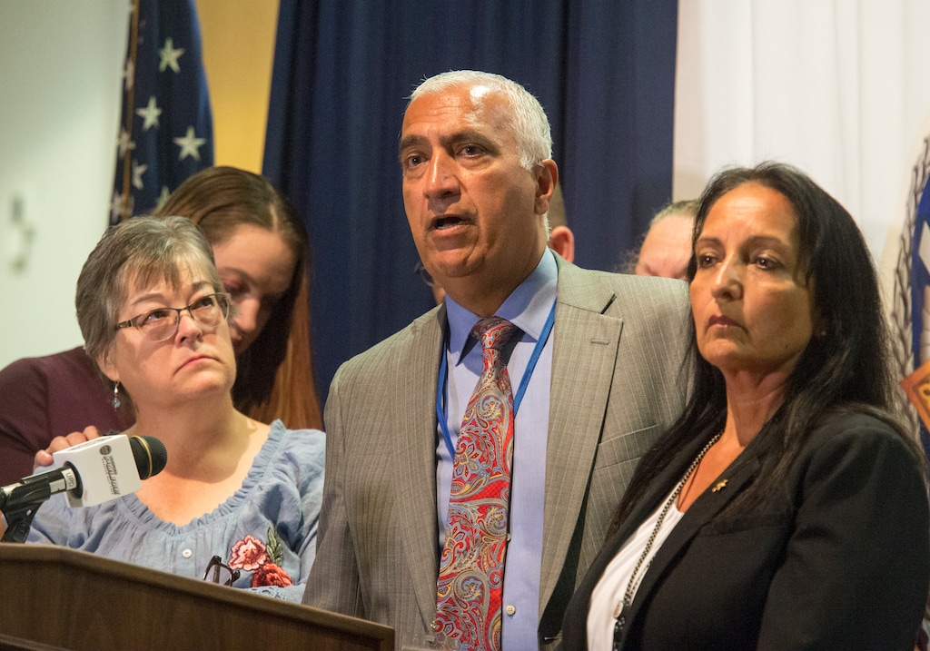 (Rick Egan  |  The Salt Lake Tribune)  (Rick Egan  |  The Salt Lake Tribune)  Salt Lake County District Attorney Sim Gill, center, speaks about charges filed against Walter Eugene Brantzeg in the beating death of his estranged wife, Valerie Sue Brantzeg, at the Salt Lake County Sheriff's Office, Friday, Sept. 7, 2018. Gill is flanked by Jeanne Long, left, Valerie's sister, and Salt Lake County Sheriff Rosie Rivera.