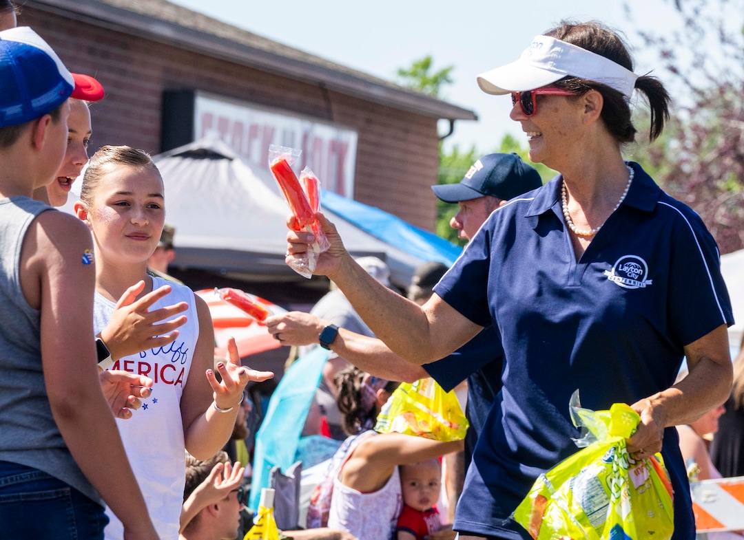 (Rick Egan | The Salt Lake Tribune) Layton Mayor Joy Petro hands out free popsicles on the parade route, before the Layton Liberty Days parade, on Monday, July 5, 2021.