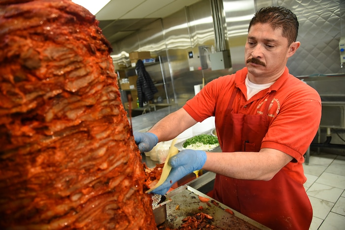 (Francisco Kjolseth  |  The Salt Lake Tribune)  Raul Aispuro assembles tacos al pastor, the most popular offering at Tacos Mi Caramelo, a late-night taqueria that is open until 2 a.m. most nights and 24-hours a day on Friday and Saturday in West Valley City.