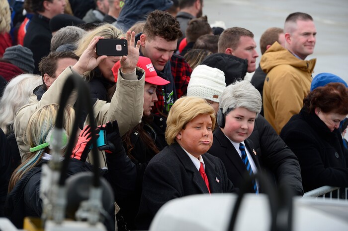 (Scott Sommerdorf   |  The Salt Lake Tribune)   Two young boys dressed as Trump waited for the arrival of Air Force One at the Ronald R Wright National Air Guard Base, Monday, December 4, 2017.  
