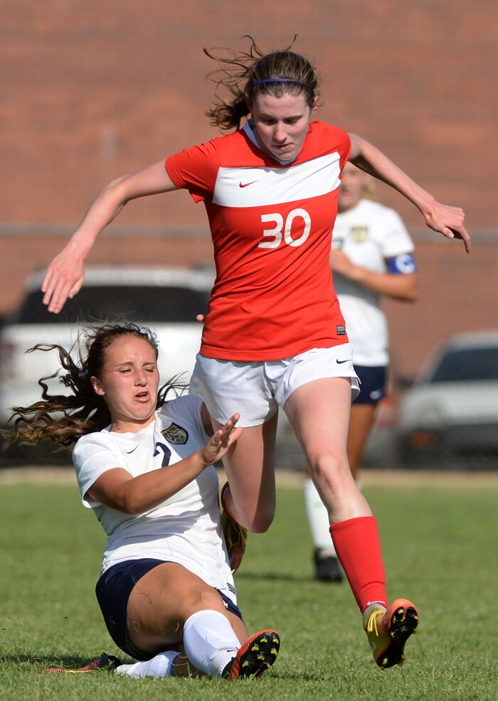 Steve Griffin / The Salt Lake TribuneBonneville's Kensie Price makes a sliding tackle on East's Catherine Hill during the Bonneville versus East girl's soccer game at Bonneville High School in Ogden Tuesday August 30, 2016. 