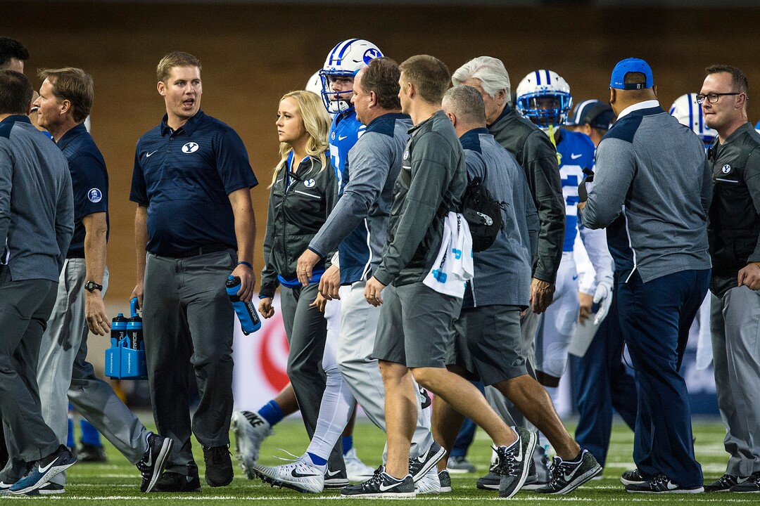 (Chris Detrick  |  The Salt Lake Tribune)  Brigham Young Cougars quarterback Beau Hoge (7) is helped off of the field after being tackled during the game at Merlin Olsen Field at Maverik Stadium Friday, September 29, 2017.