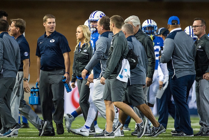 (Chris Detrick  |  The Salt Lake Tribune)  Brigham Young Cougars quarterback Beau Hoge (7) is helped off of the field after being tackled during the game at Merlin Olsen Field at Maverik Stadium Friday, September 29, 2017.