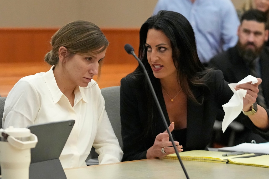 (Rick Bowmer | Associated Press file photo) Kouri Richins, left, a Utah mother of three who authorities say fatally poisoned her husband then wrote a children's book about grieving, speaks with her attorney Skye Lazaro during a bail hearing Monday, June 12, 2023, in Park City, Utah. A judge ruled to keep her in custody for the duration of her trial.