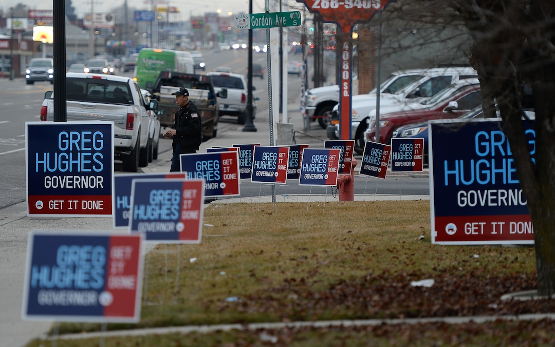 (Francisco Kjolseth  |  The Salt Lake Tribune) Campaign signs are put up around Dee's Automotive in Murray, the site where former House Speaker Greg Hughes announced his campaign for governor on Wednesday, Jan. 8, 2020.