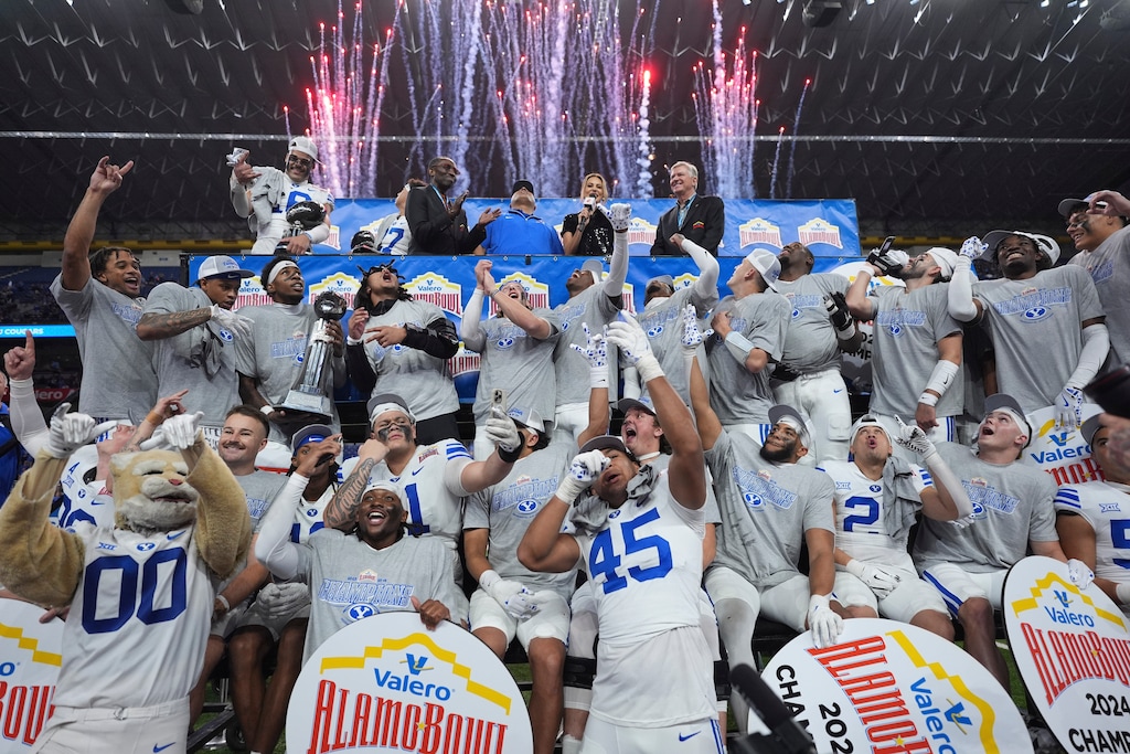 BYU players celebrate after their win over Colorado in the Alamo Bowl NCAA college football game, Saturday, Dec. 28, 2024, in San Antonio. (AP Photo/Eric Gay)