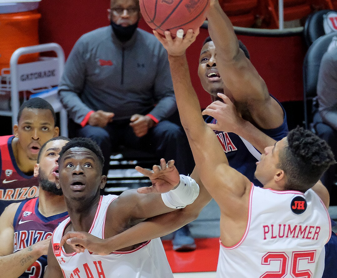 (Leah Hogsten | The Salt Lake Tribune) Utah Utes guard Alfonso Plummer (25) is blocked by Arizona Wildcats center Christian Koloko (35) as the University of Utah host the Arizona Wildcats, Feb. 4, 2021 at the Jon M. Huntsman Arena.