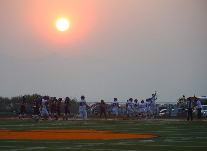(Leah Hogsten  |  The Salt Lake Tribune)  Herriman's Jake Jutkins makes a touchdown in the second quarter. Brighton High School leads Herriman High School 9-7 at the half during the 2015 season opener at Brighton High School, Friday, August 21, 2015. 