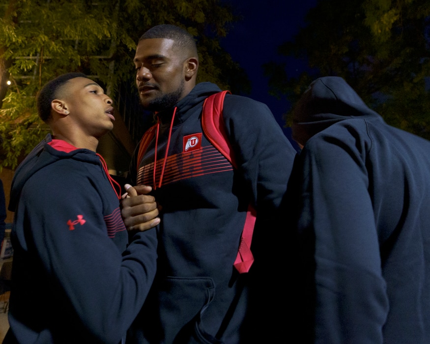 (Leah Hogsten | The Salt Lake Tribune) The University of Utah football team mourns the loss of fellow student-athlete Aaron Lowe during a candlelight vigil at the A Ray Olpin Student Union southwest lawn, Sept. 29, 2021.