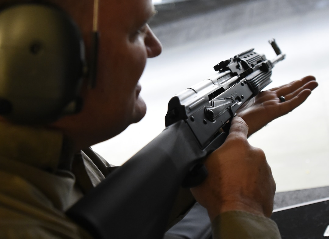 (Francisco Kjolseth  |  The Salt Lake Tribune)  Utah gun rights advocate Clark Aposhian, one of only a handful of Americans who are legally allowed to keep their bump stock, a shooting accessory that alters semi-automatic rifles to fire in quick bursts like a machine gun, demonstrates how it works on an AKM-47 at a gun range in Murray, UT, on Thursday, April 4, 2019. He is challenging the bump stock ban in court, and an appeals court has allowed him to keep his bump stock until his case is resolved in court.