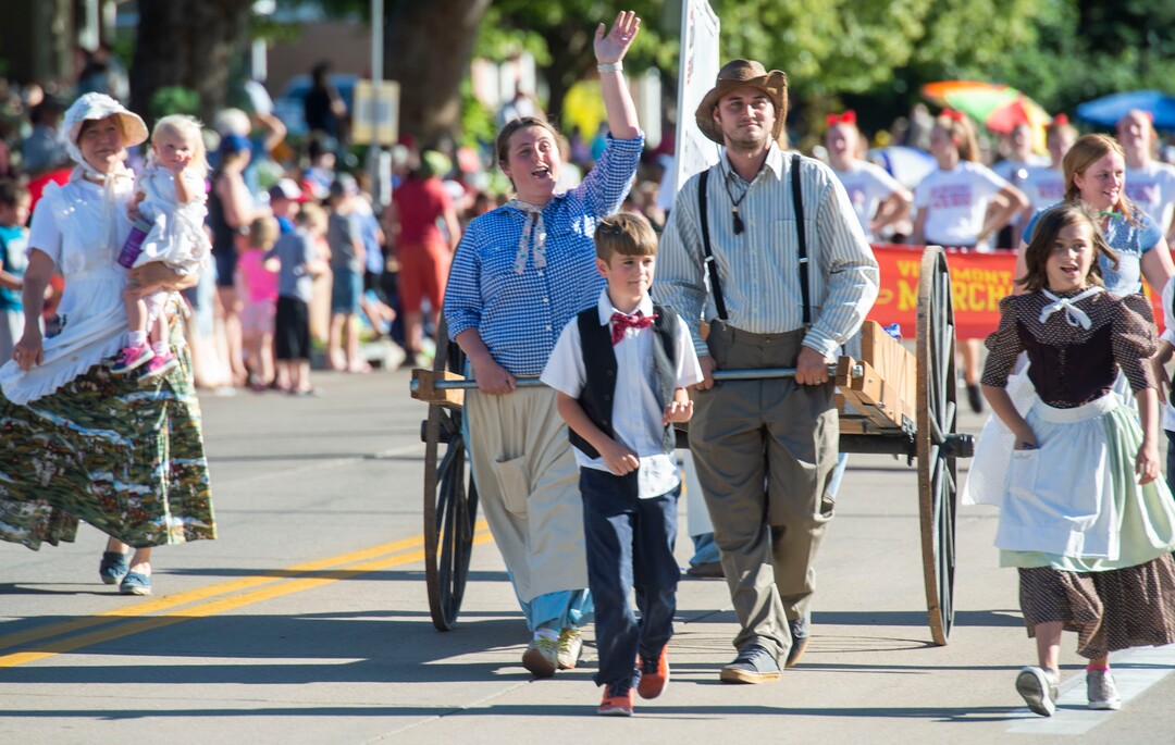 (Rick Egan  |  The Salt Lake Tribune)    People dressed like Mormon Pioneers, walk in the Bountiful Handcart Days Parade, Friday, July 19, 2019.