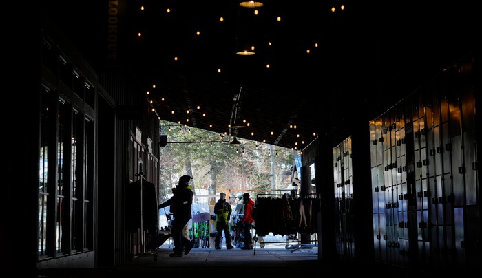 (Bethany Baker | The Salt Lake Tribune) People gather outside one of the shops at Sundance Resort near Provo on Thursday, Dec. 14, 2023.