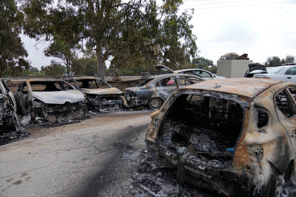 (Ohad Zwigenberg | The Associated Press) Destroyed cars are seen at the rave party site near the Kibbutz Re'im, close to the Gaza Strip border fence, on Tuesday, Oct. 10, 2023. Israel's rescue service Zaka said paramedics had recovered at least 260 bodies of people killed in a surprise attack by Hamas militants Saturday.