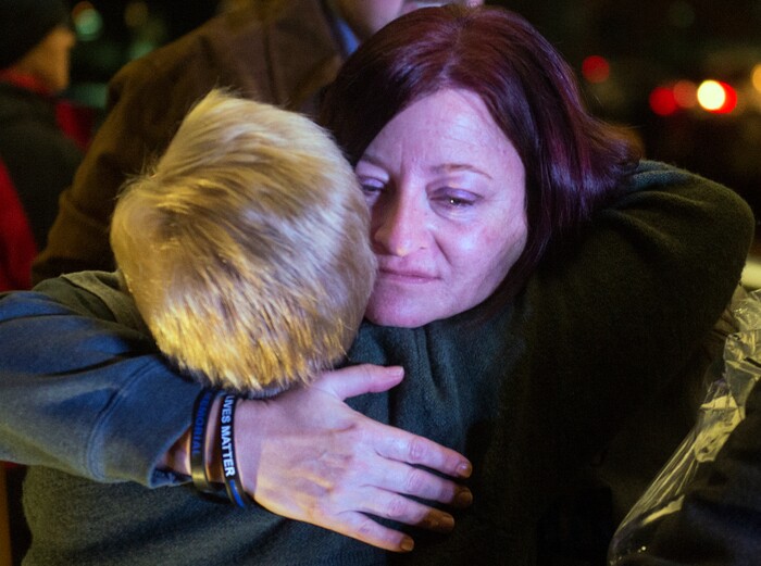 (Rick Egan  |  The Salt Lake Tribune)  Jenny Brotherson, mother of Cody Brotherson, gets a hug after a memorial ceremony at Fairbourne Station Plaza in West Valley City, in remembrance of her son Cody, who was killed in the line of duty one year ago today. Monday, November 6, 2017.
