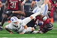 BYU quarterback Bear Bachmeier (47), left, fumbles the ball after being hit by Texas Tech's Anthony Holmes Jr., right, in the second half of a Big 12 Conference championship NCAA college football game Saturday, Dec. 6, 2025, in Arlington, Texas. (AP Photo/Julio Cortez)