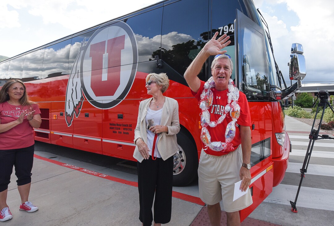 (Francisco Kjolseth  |  The Salt Lake Tribune)  University of Utah athletic director Chris Hill says goodbye to friends and staff at the Huntsman Center on Friday, June 1, 2018, as he gets ready to climb aboard a red Ute-branded Holiday Motor coach bus, alongside his wife Kathy, to the sounds of cheers and applause after 31 years on the job.
