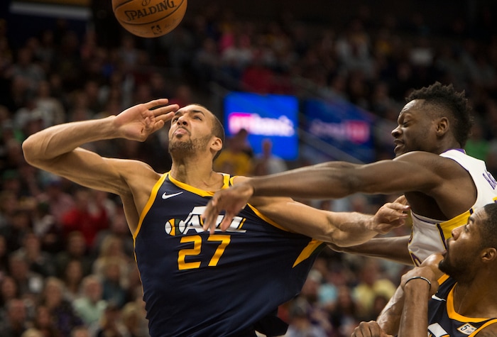 (Rick Egan  |  The Salt Lake Tribune)   Los Angeles Lakers forward Julius Randle (30) grabs Utah Jazz center Rudy Gobert (27), as he goes for a rebound, in NBA action, Utah Jazz vs. Los Angeles Lakers, in Salt Lake City, Saturday, October 28, 2017.