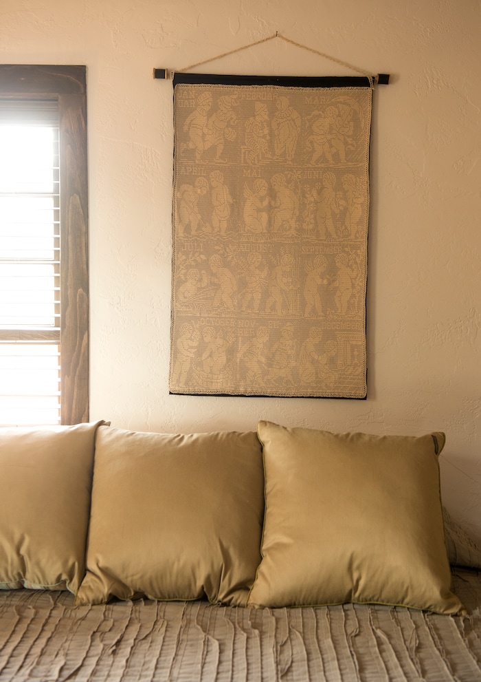 (Leah Hogsten  |  The Salt Lake Tribune) The remodeled 1886 cabin is decorated with family heirlooms, including the thin-thread crochet calendar made by Dawn's mother, Lilac Huether House, who died in 2013. The one-room frontier house was dilapidated and boarded up and had sat vacant for 50 years, when Dawn House purchased the 1886 home in Torrey.