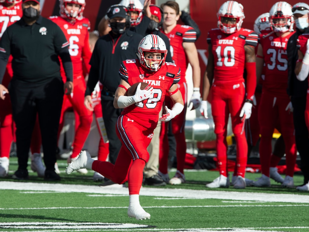 (Rick Egan | The Salt Lake Tribune) Utah Utes wide receiver Britain Covey (18), grabs a pass and scores on a 91-yard touchdown play, in PAC-12 football acton between Utah Utes and Washington State Cougars at Rice-Eccles Stadium on Saturday, Dec. 19, 2020.