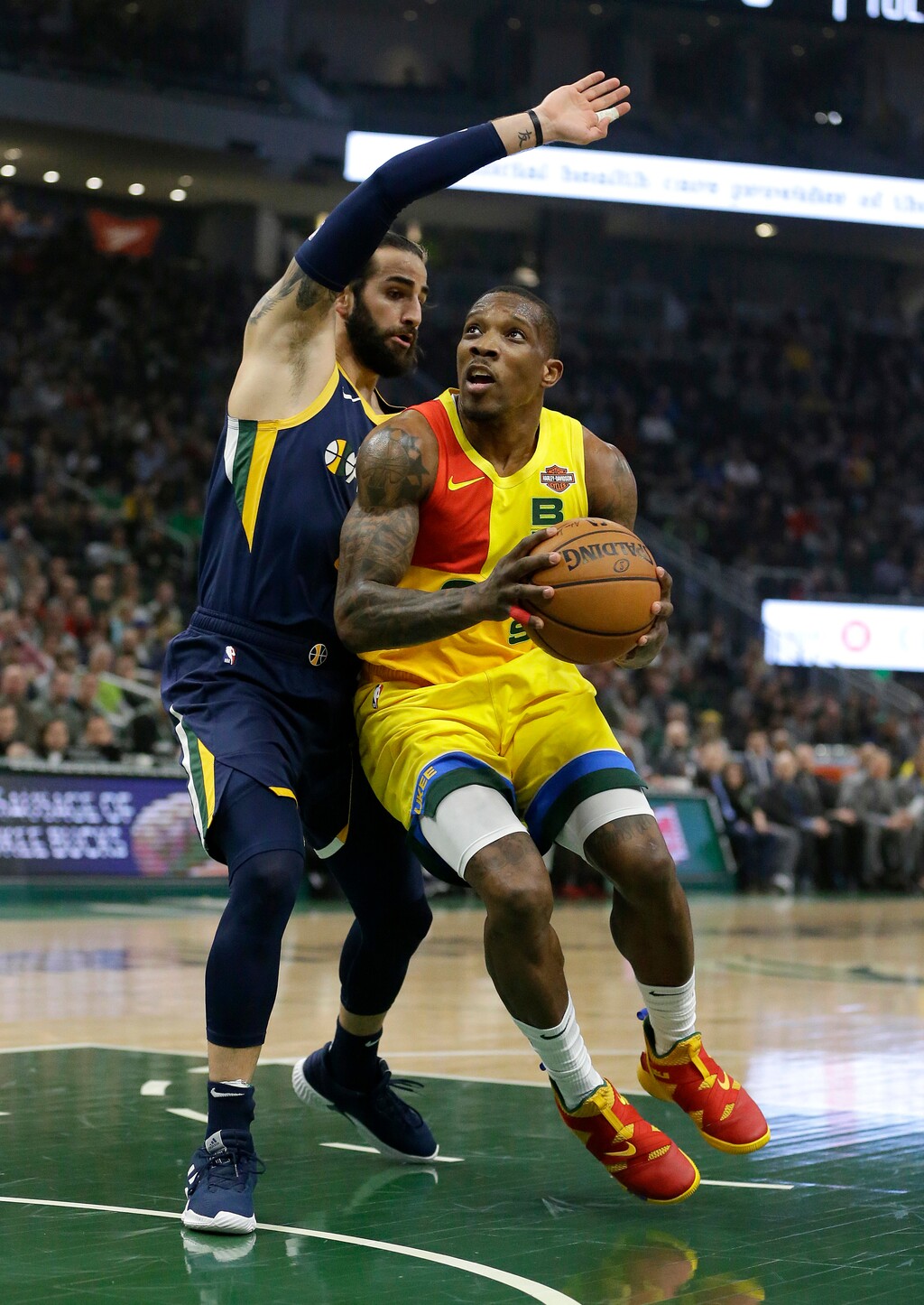 Milwaukee Bucks' Eric Bledsoe, right, drives to the basket against Utah Jazz's Ricky Rubio during the first half of an NBA basketball game Monday, Jan. 7, 2019, in Milwaukee. (AP Photo/Aaron Gash)