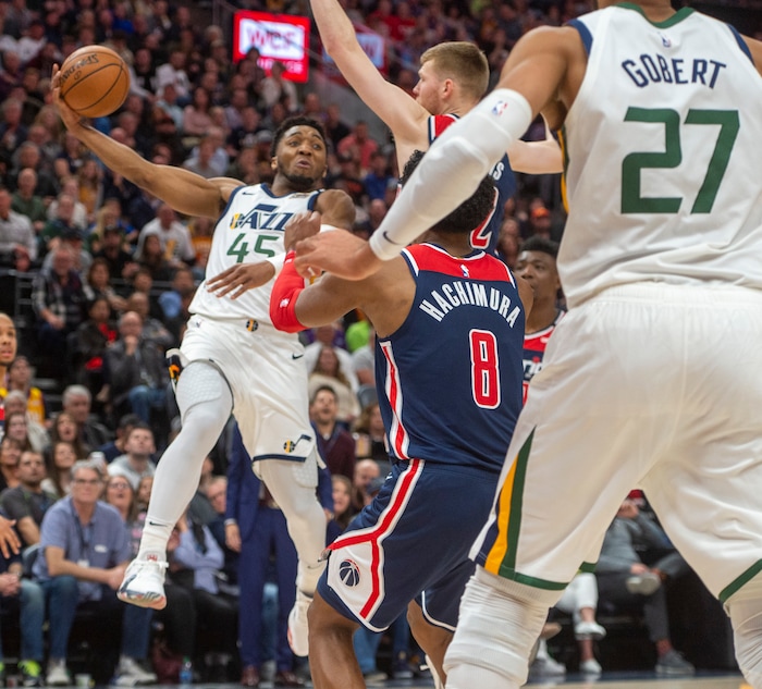 (Rick Egan  |  The Salt Lake Tribune)  Utah Jazz guard Donovan Mitchell (45) swigs a pass back out to the perimeter, in NBA action between the Utah Jazz and the Washington Wizards, in Salt Lake City, Friday, February 28, 2020