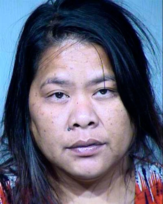 (Maricopa County Sheriff's Office via AP file) This undated photo provided by the Maricopa County Sheriff's Office shows 46-year-old Lynwood Jennet, who authorities say helped Maricopa County Assessor Paul Petersen in what authorities have called an illegal adoption scheme involving women from the Marshall Islands. She pleaded guilty to conspiracy and theft charges stemming from the adoption scheme, acknowledging that she helped arrange benefits from Arizona's Medicaid program for expecting mothers even though the women didn't live in the state.
