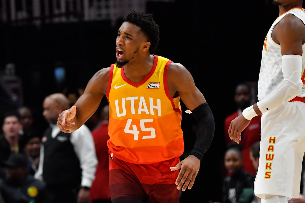 Utah Jazz guard Donovan Mitchell (45) reacts after sinking a three-point basket during the second half of an NBA basketball game against the Atlanta Hawks, Thursday, Dec. 19, 2019, in Atlanta. (AP Photo/John Amis)
