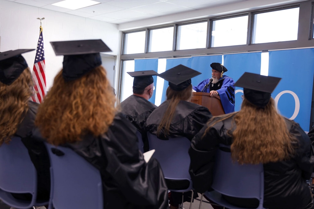 (Alec Langton) David Bokovoy, director of prison education at Salt Lake Community College, speaks to the first class of incarcerated graduates during a commencement ceremony at the Utah State Correctional Facility on July 10, 2023.