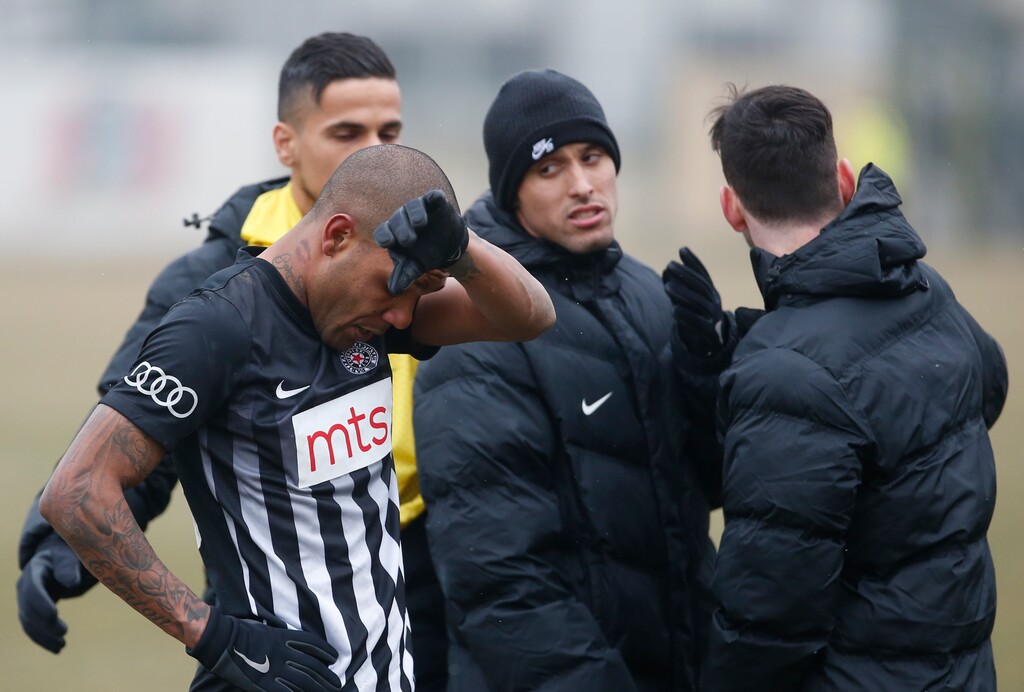 Partizan Belgrade's Brazilian player Everton Luiz, left, leaves the field during a Serbian championship match between Rad and Partizan, in Belgrade, Serbia, Sunday, Feb. 19, 2017. (AP Photo/Miroslav Todorovic)