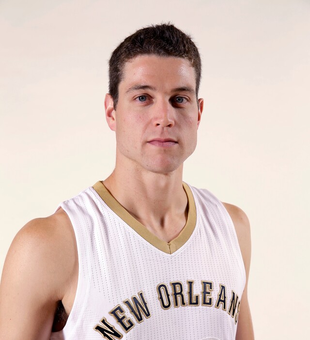 FILE - In a Sept. 29, 2014 file photo, New Orleans Pelicans guard Jimmer Fredette (32) poses at the Pelicans NBA basketball media day in Metairie, La. Officials with the Glens Falls, N.Y. City School District say Jimmer Fredette and the Fredette Family Foundation have donated nearly 900 Russell Athletic hoodies and zip-up sweatshirts to elementary school students in his hometown. Fredette was a star at Glens Falls High School and Brigham Young University. He currently plays for the New Orleans Pelicans. (AP Photo/Gerald Herbert, File)