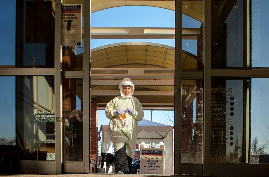 (Rick Egan | The Salt Lake Tribune)  Christy Danielson tests patients for Covid-19 at the Intermountain Healthcare Cottonwood InstaCare on Friday, Dec. 4, 2020.